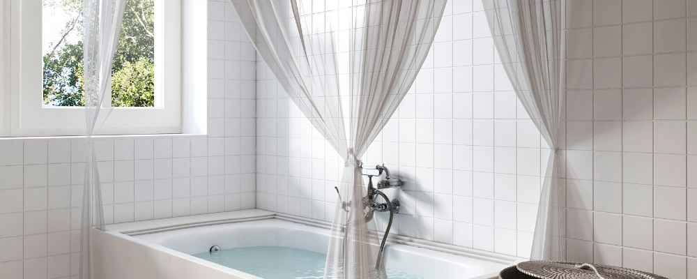 20._Add curtains to your bathtub